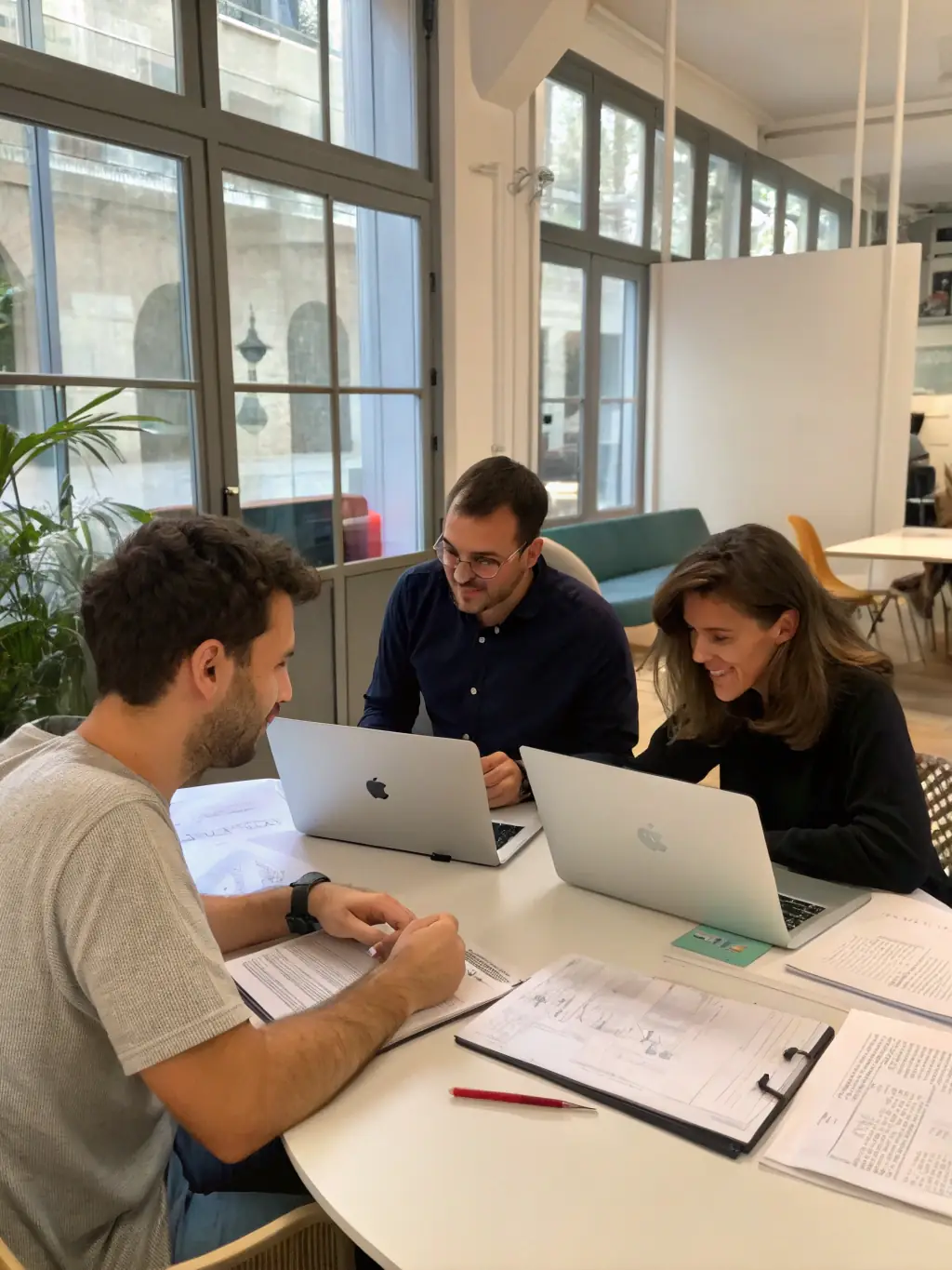 A consultant reviewing a go-to-market strategy document with a startup founder in a modern office setting, emphasizing collaboration and strategic planning.